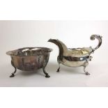 An Edwardian silver sauceboat of traditional form together with a silver bowl with fluted decoration