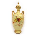 A Royal Worcester blush ivory lidded urn with hand painted floral decoration, date mark 1894, h 51