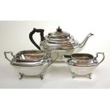 A George V silver three-piece tea set of squat form. Hallmarked for Sheffield 1922, makers mark