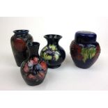 A small Moorcroft Hibiscus pattern ginger jar together with three vases to include Pomegranate, h.