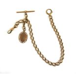 An early 20th century 15ct rose gold albert chain with a 9ct gold fob. Approx weight 49.6g