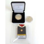 A 14ct gold 1933 Double Eagle Replica miniature coin together with two Morgan dollars dated 1900 and