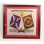 A hand embroidered silk picture depicting the flags of the Northumberland Fusiliers and presented at