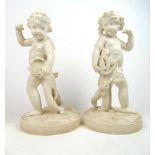 A pair of Minton Parian ware figures of Putto holding musical instruments, h. 39 cmTamborine playing