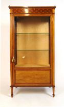 An Edwardian mahogany, boxwood strung and satinwood banded display cabinet, the brass galleried