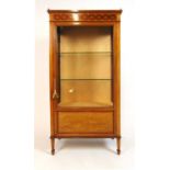 An Edwardian mahogany, boxwood strung and satinwood banded display cabinet, the brass galleried