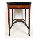 An Edwardian rosewood and marquetry envelope card table, the four segment top over a single drawer