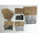 A collection of 1930s German cigarette cards in original packaging
