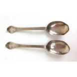 A pair of 17th century continental white metal trefid spoons, the handles engraved 'M.C 1698'.