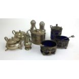 A collection of silver condiment items to include, salts, pepper pots and mustard pots. Various
