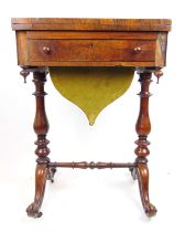 A Victorian rosewood games/work table, the fold over top with inlaid chess and backgammon board over
