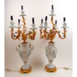A Pair of modern table lamps by Tiche, the parcel gilt white and blue glazed urn body under the gilt