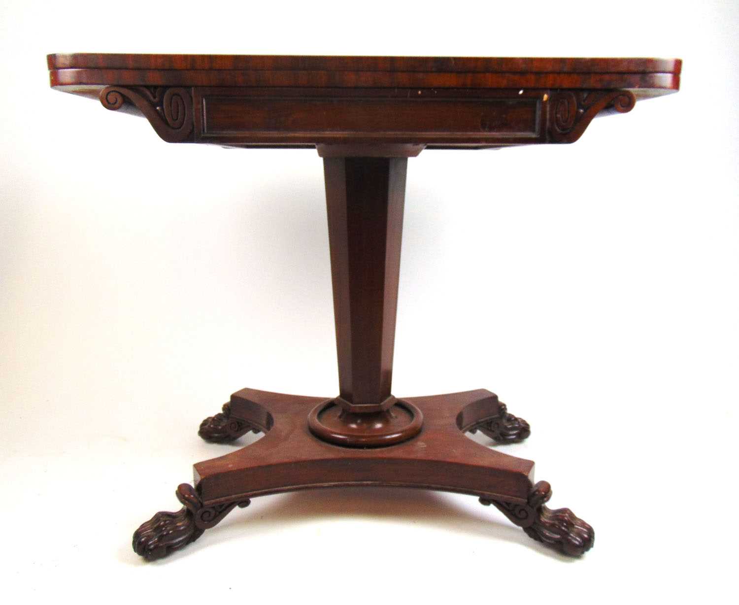 A William IV mahogany card table, the fold over top supported on a swivel action over the tapering