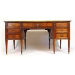 A 19th century French rosewood, kingwood, boxwood strung and brass mounted freestanding desk (bureau