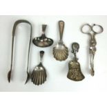 An collection of silver and white metal caddy spoons and sugar tongs. Various hallmarks. Approx