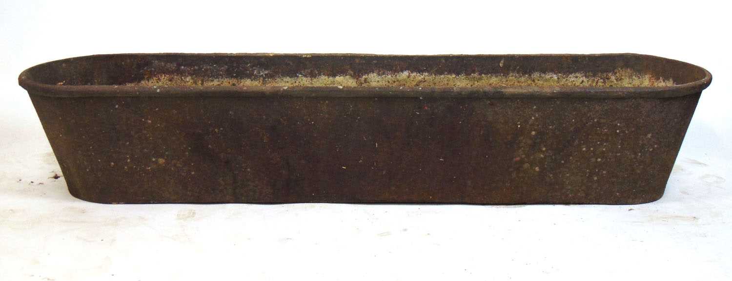 A large 19th century iron trough, h. 35 cm, l.186 cmDirty.