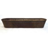 A large 19th century iron trough, h. 35 cm, l.186 cmDirty.