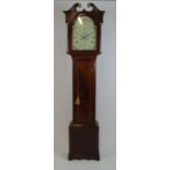 A late 18th century mahogany and boxwood strung long case clock, the swan neck pediment over the