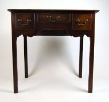 A mid 18th century walnut low boy, the top over three drawers on moulded legs, h. 74 cm, w. 78 cm,