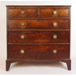 An 18th centruy oak and mahogany banded chest of two short over three long drawers on bracket