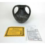 A Chinese early Han Dynasty ceramic 'Eye Pot' with accompanying certificate and receipt, h. 16.5 cm