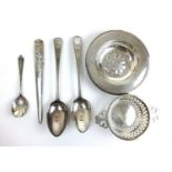 A silver alms dish together with silver strainer and a selection of flatware. Various hallmarks.