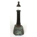 A large Cornish serpentine table lamp in the form of a lighthouse, h. 55 cmGlass cracked