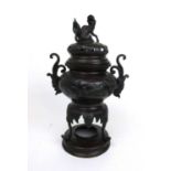 A 20th century Chinese bronze censer, the body with relief cast bird decoration, the lid adorned