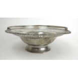 A George III silver basket with pierced reticulated decoration. Hallmarked for London 1805, makers