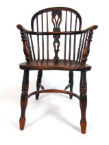 A 19th century elm and ash Windsor chair, the back with pierced splat over the shaped seat on turned