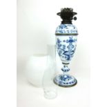 A late 19th/early 20th century Meissen Onion pattern porcelain oil lamp with duplex burner, h. 67