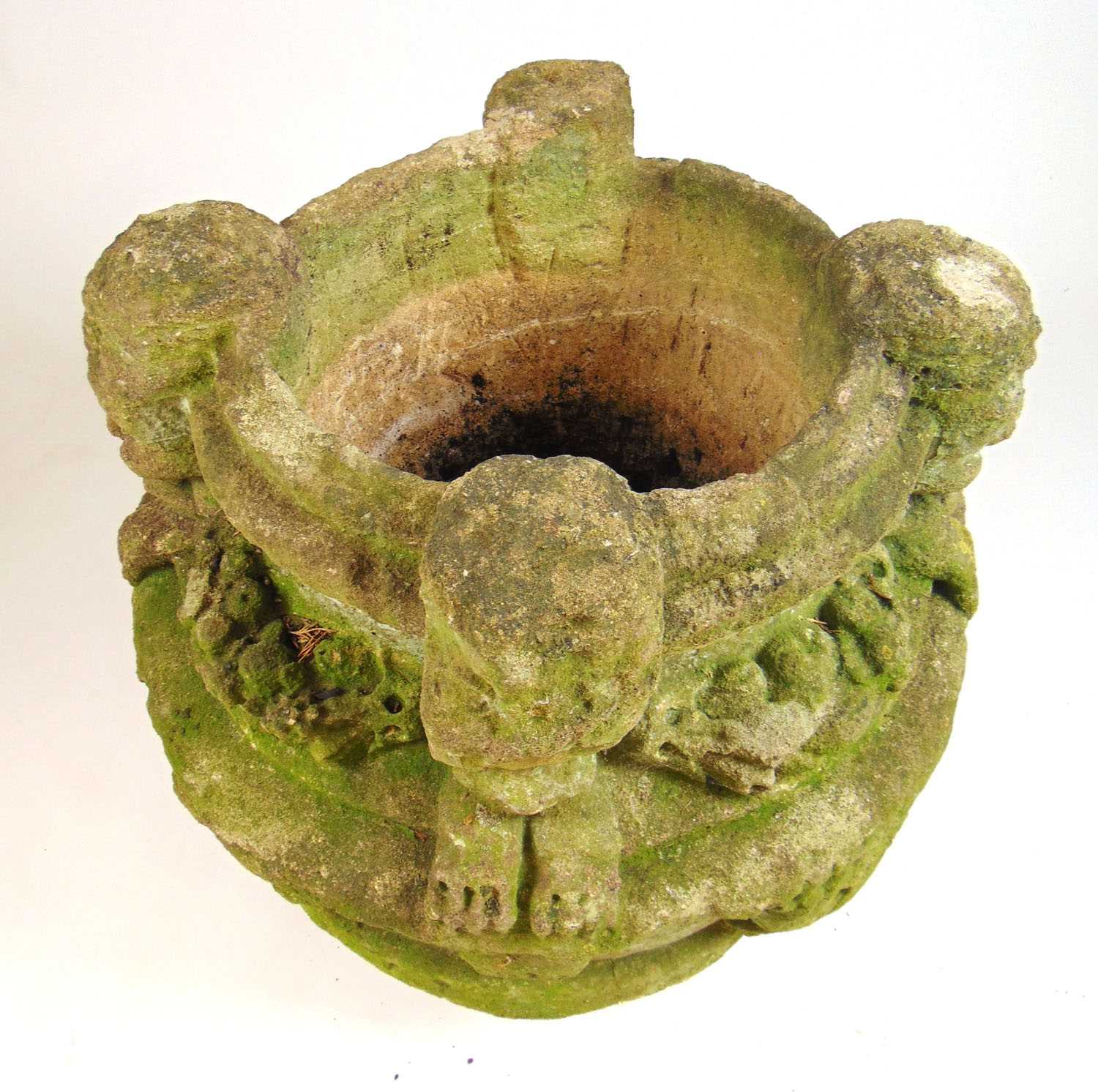 A possible medieval carved stone font, the rim with four masks holding floral swags in their - Bild 3 aus 7
