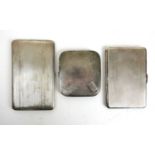 Three silver engine turned cigarette cases. Various hallmarks. Approx weight 558g