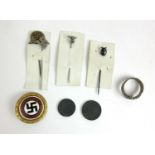 A collection of Third Reich and Third Reich type items to include a gold NSDAP badge, navy ring,