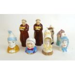 A collection of Royal Worcester candle snuffers to include monks, nun, Punch, Baby etc.Small chip to