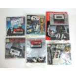 A collection of Star Wars tapes and read along books together with a Return of the Jedi storybook