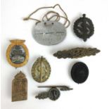 A collection of Third Reich and Third Reich type badges to include an SS dog tag, High Seas Fleet