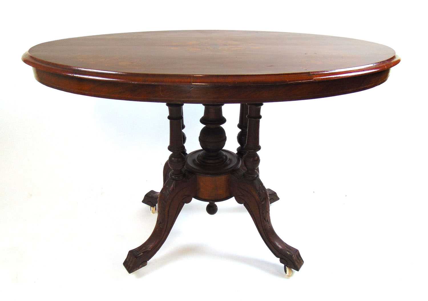 An Edwardian burr walnut and marquetry breakfast table, the oval quarter veneered top on the five