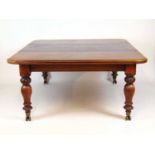 A Victorian mahogany extending dining table, the moulded top on pull-out mechanism with three leaf's