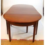 An early 19th century mahogany, marquetry and rosewood banded dining table comprising of two D-ends,