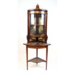 An Edwardian rosewood, boxwood strung and marquetry floorstanding corner display cabinet, the
