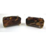 A pair of 19th century tortoiseshell needle boxes with studwork decoration and bone bun feet, l. 6.5