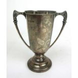 An Elizabeth II silver cup having Celtic style decoration to the rim and handles. Hallmarked for