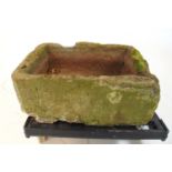 A sandstone sink, h.30 cm, w. 78 cm, d. 57 cmWeathered. Repairs to one corner. Trolly not included