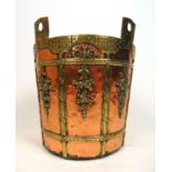 A 19th century copper and brass mounted coal bucket, teh body decorated with columns, bows and