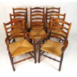 A near set of eight (6+2) reproduction ash framed ladder back dining chairs with rush seats, h. 94