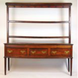 An 18th century oak dresser, the plate rack over the base with three drawers on tapering legs, h.