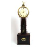 A late 19th century American mahogany, brass and verre eglomise drop dial wall clock. the eagle