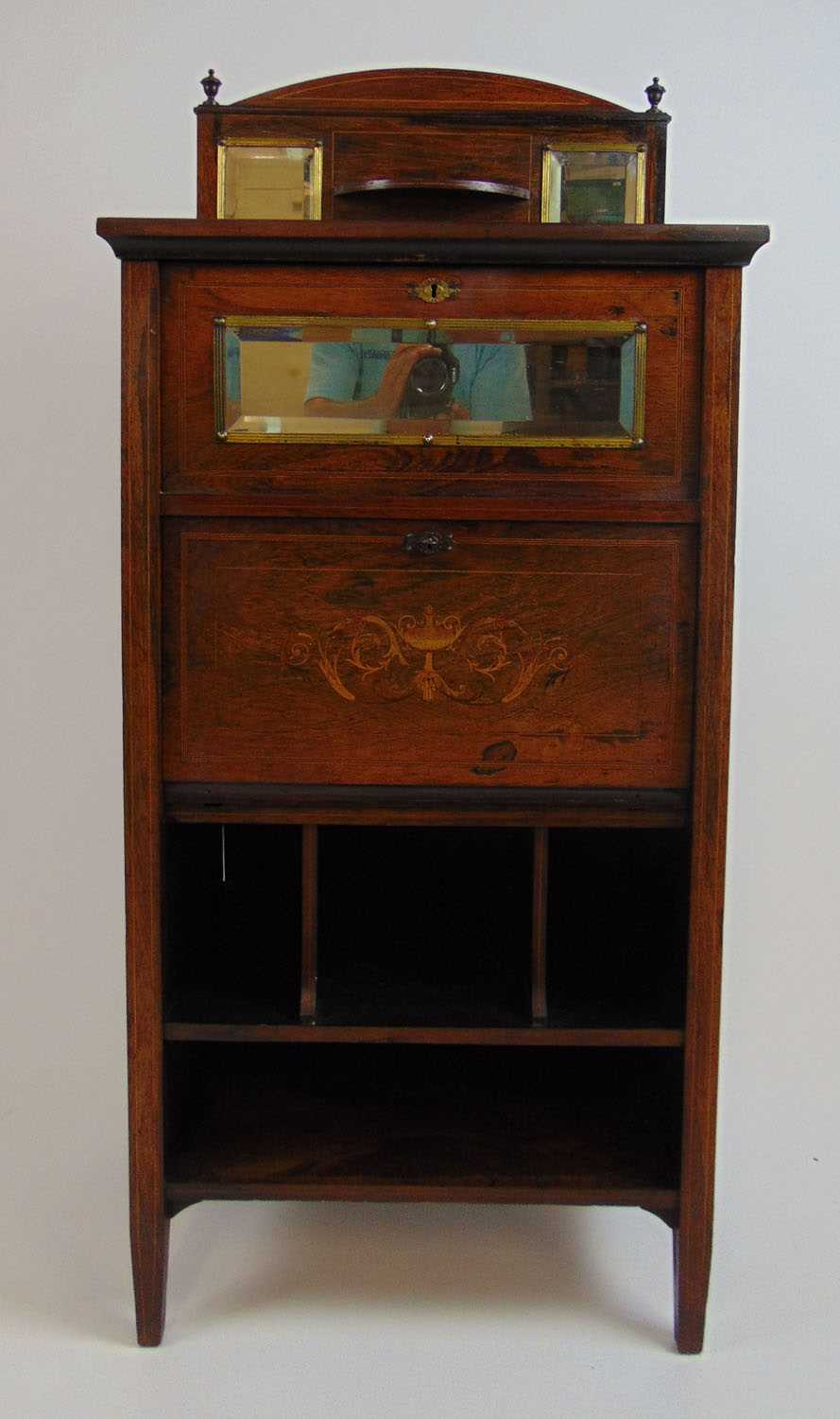 An Edwardian rosewood, boxwood strung and marquetry music cabinet, the back with beveled mirrors