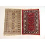 Two hand woven rugs, an Afghan silk and a Persian, 93 cm x 62 cmWear to edge's.